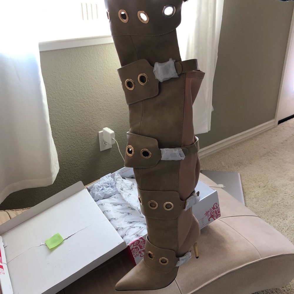 Tan leather knee high boots. Never worn